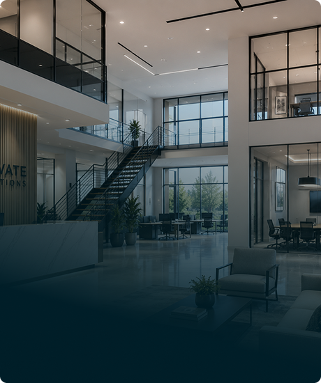 Modern office lobby with large windows, a staircase, seating area, and meeting rooms.