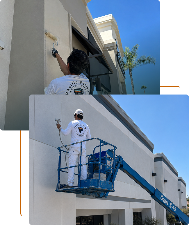 Two workers painting the exterior walls of a commercial building; one on the ground using a roller brush, the other on a lift applying paint to higher sections.