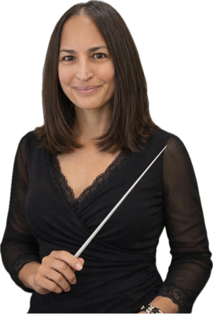 A woman with shoulder-length brown hair wearing a black blouse with lace details, holding a conductor's baton, smiling at the camera.
