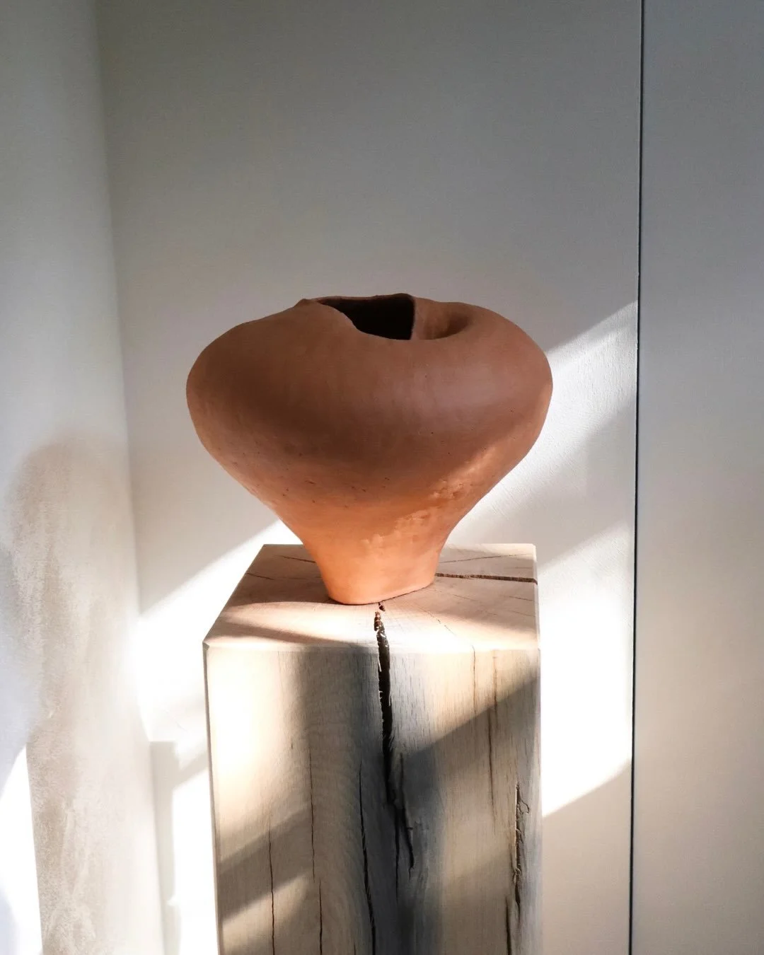TERRA No. 07

A one-of-a-kind sculptural vessel, shaped by hand from warm red clay. Its generous rounded body, narrow base and irregular opening give the piece a strong yet organic presence.

Fired at 1050&deg;C and intentionally left unglazed, the v