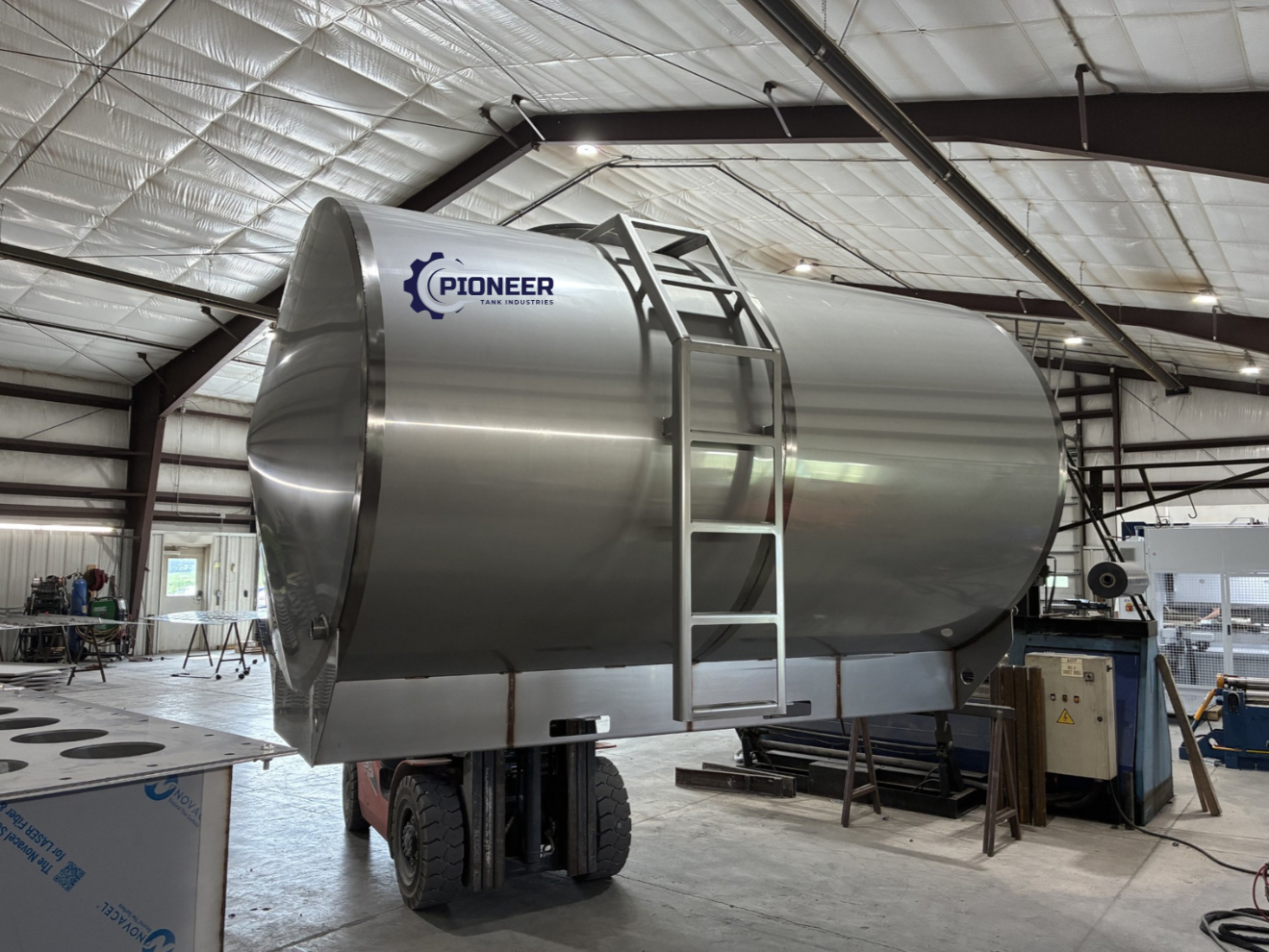 3,250 gallon stainless steel cone-end straight-leg tank outside the Pioneer Tank Industries facility.