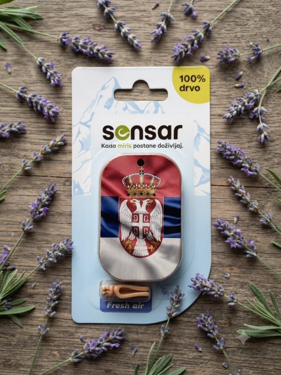 A car air freshener with the Serbian flag and coat of arms, placed on a wooden surface surrounded by lavender flowers.