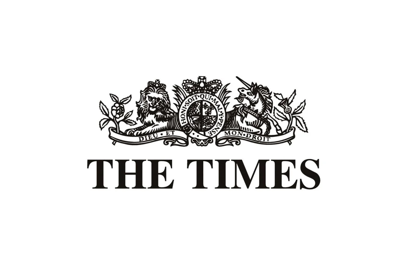Logo of The Times newspaper featuring a crest with a lion, a unicorn, and a shield, along with the motto 'HONI SOIT QUI MAL Y PENSE' and the phrase 'DIEU ET MON DROIT', and the text 'THE TIMES' below it.