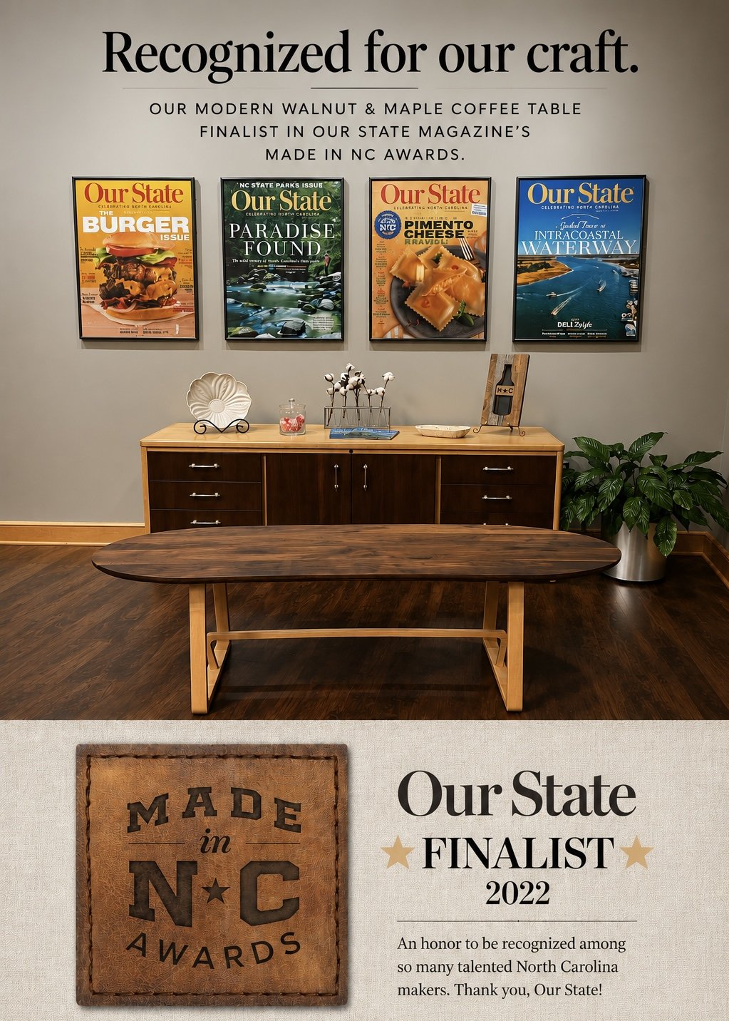 Decorative wall with four framed magazine covers featuring North Carolina topics, above a wooden sideboard with decorations including a large seashell display, a small jar, and a cotton plant sculpture. A wooden table in the foreground, and a potted plant in the corner.