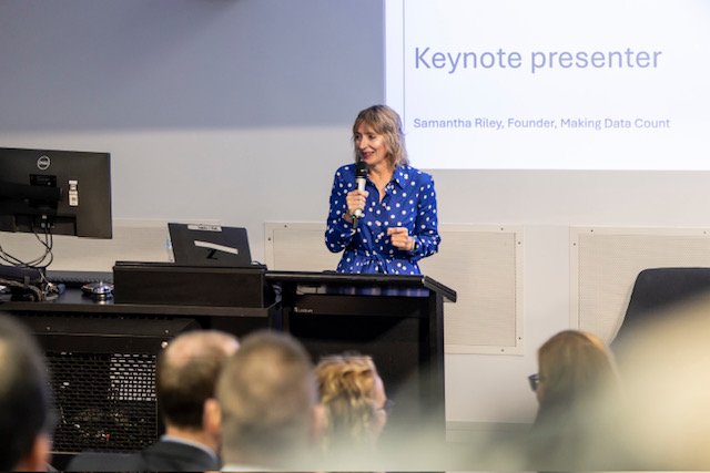 Sam Riley delivering a keynote presentation on Making Data Count in Australia.