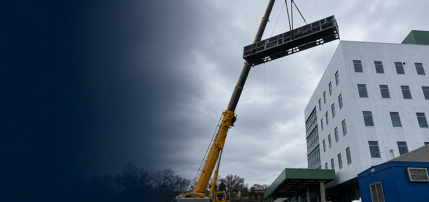 Crane lifting equipment at a healthcare construction project in West Virginia.