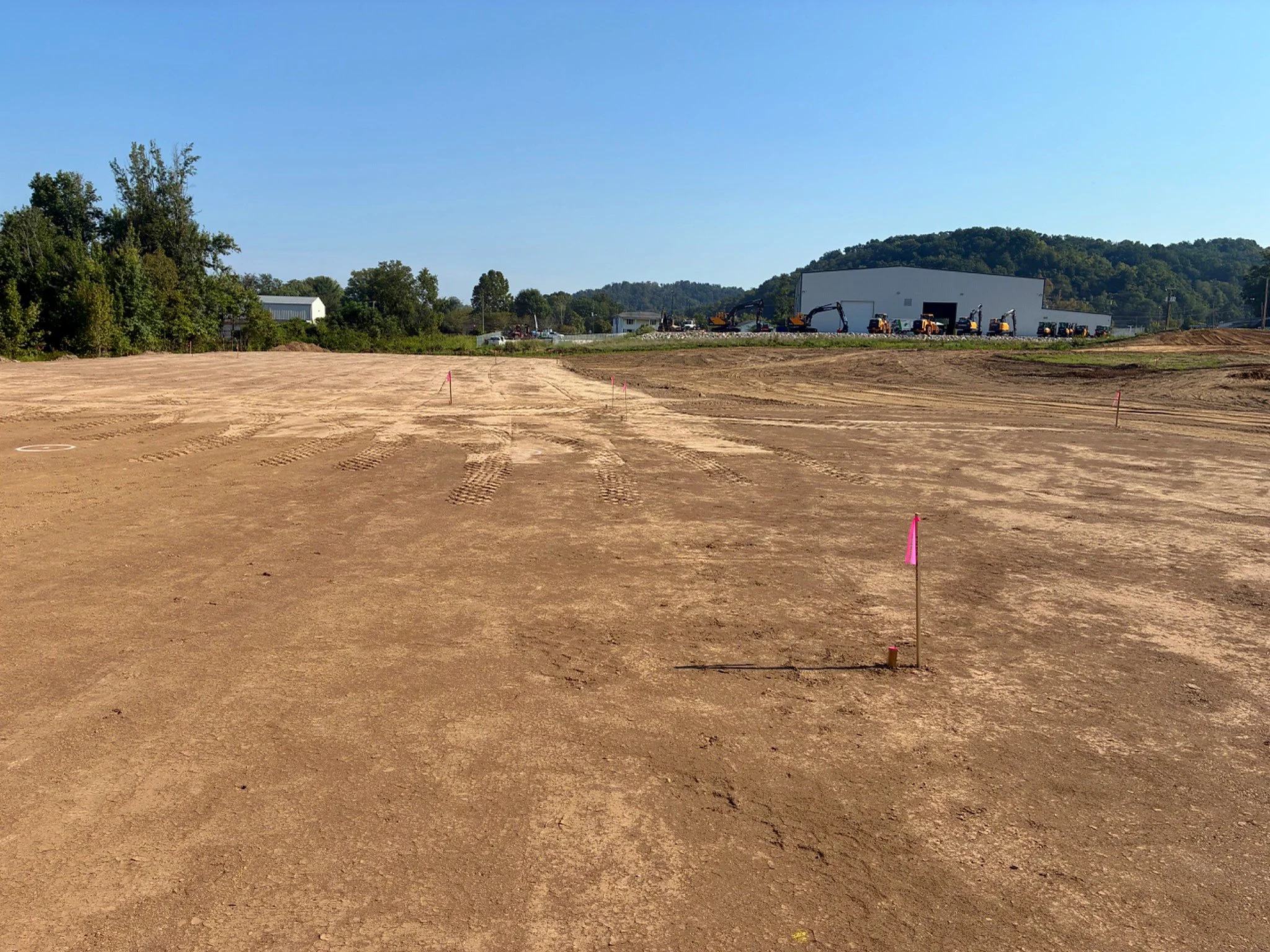 Survey and grade stakes across the prepared building pad at the Barboursville Healthcare Center construction site in Barboursville, West Virginia.