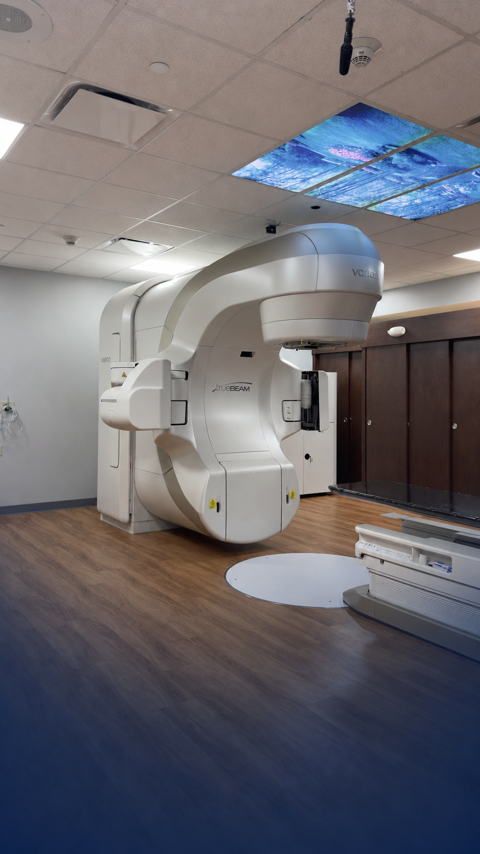 Vertical view of the Varian TrueBeam linear accelerator and illuminated ceiling panels at St. Mary’s Medical Center.