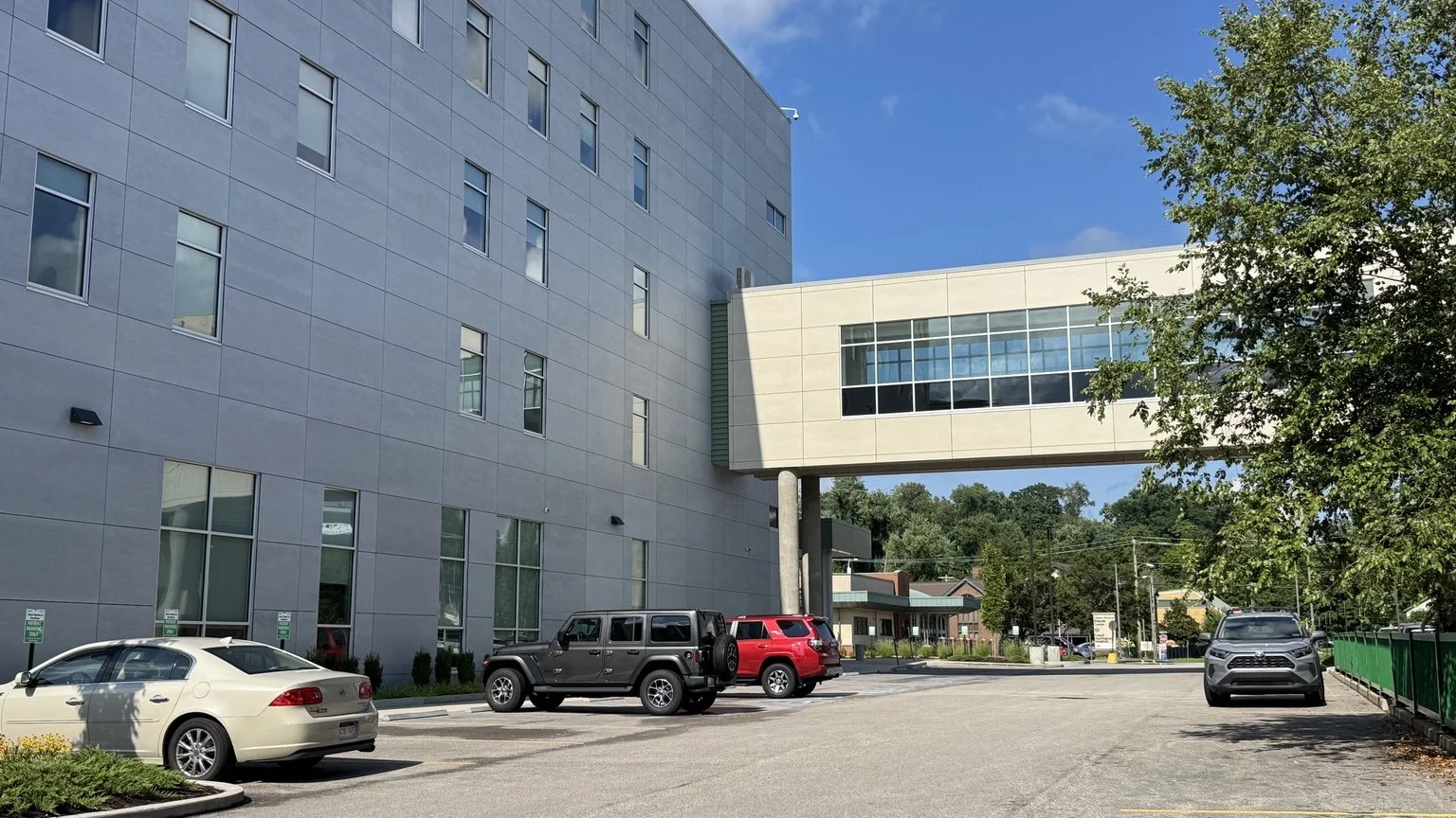 Robert & Lena Shell Medical Pavilion with parking area and enclosed pedestrian connector at Cabell Huntington Hospital.