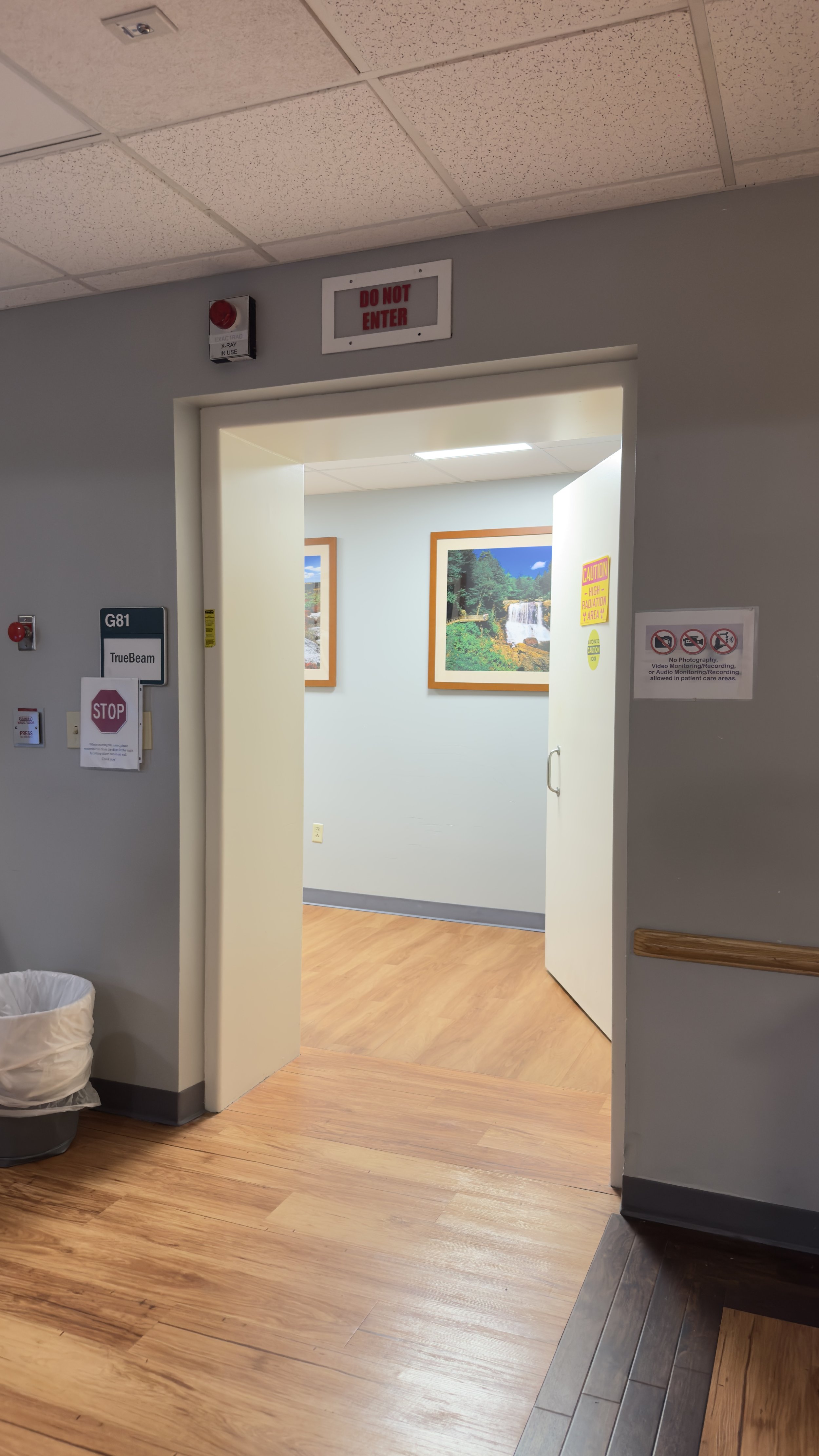 Hospital corridor leading to the shielded TrueBeam treatment-room entrance at St. Mary’s Medical Center Radiation Oncology.