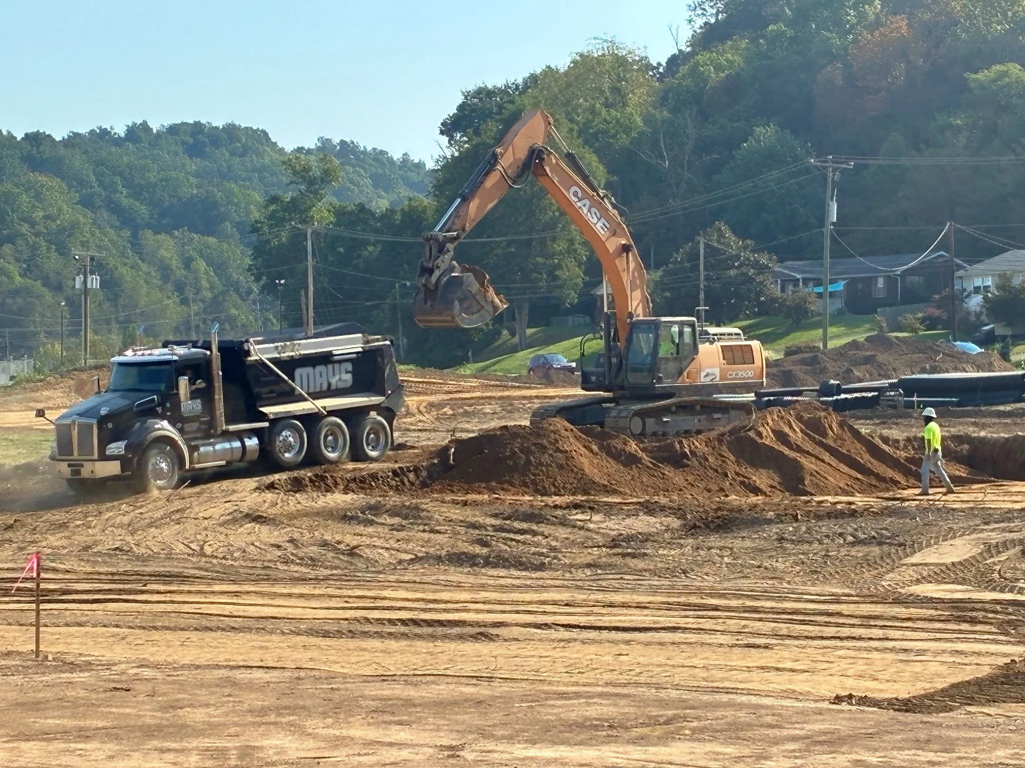 CASE excavator loading a dump truck during early sitework for the Barboursville Healthcare Center in Barboursville, West Virginia.