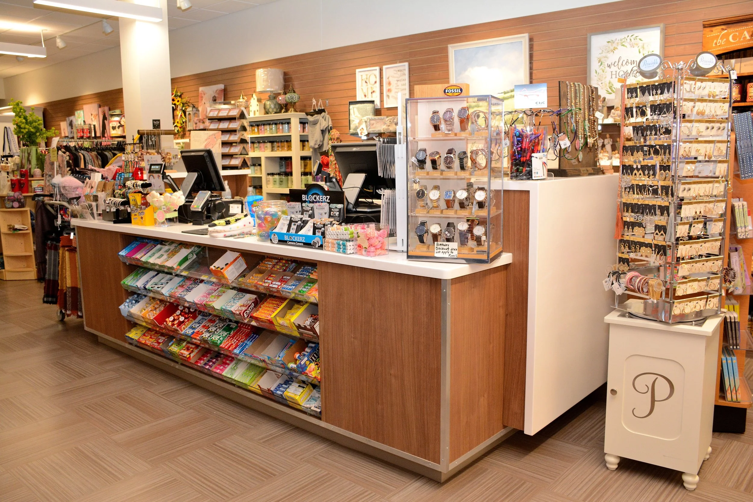 Interior of the Cabell Huntington Hospital gift shop with checkout counter, merchandise displays, and retail shelving.