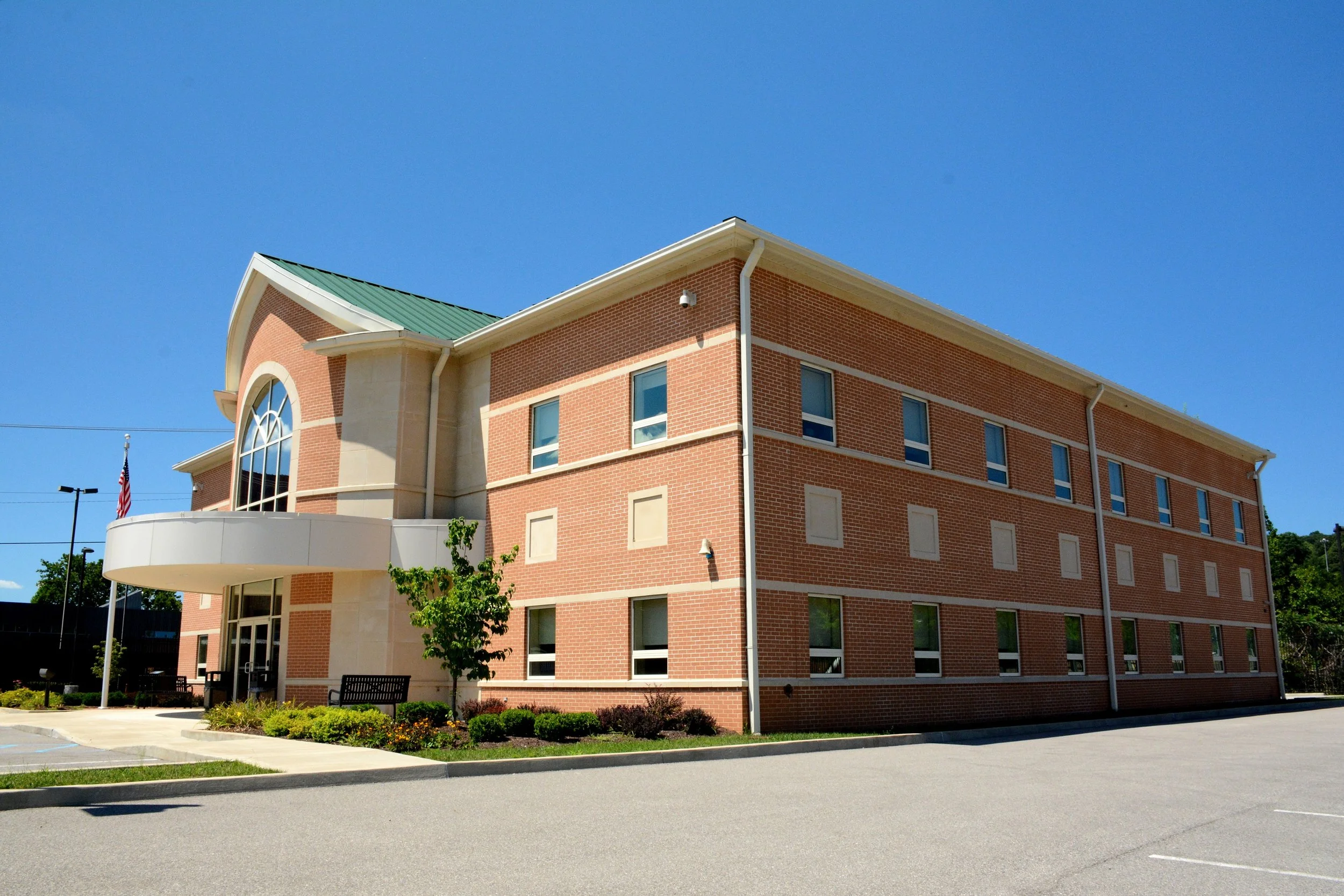 Exterior view of the West Virginia Water Development Authority office building and adjacent parking area.