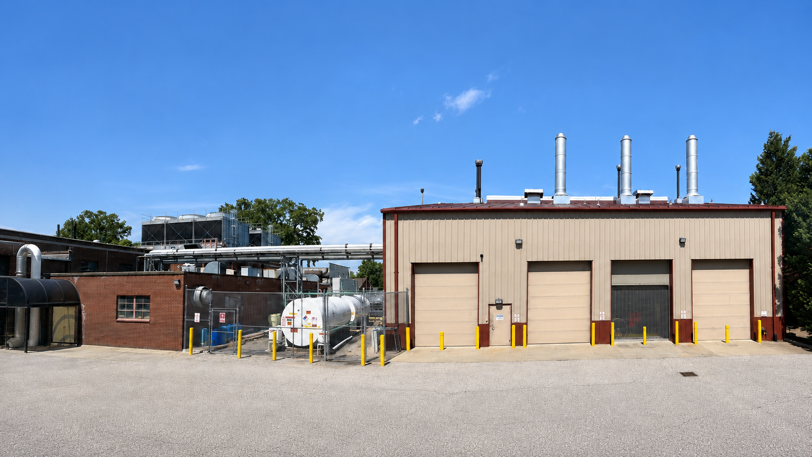 Exterior of the St. Mary’s Medical Center Boiler Plant in Huntington, West Virginia, with boiler stacks, piping and mechanical equipment.