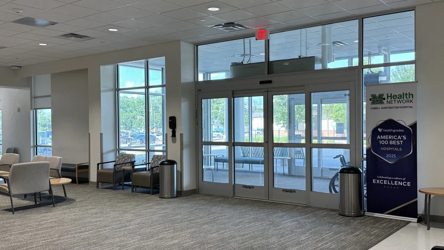Main entrance waiting area inside the Robert & Lena Shell Medical Pavilion with seating and exterior views.