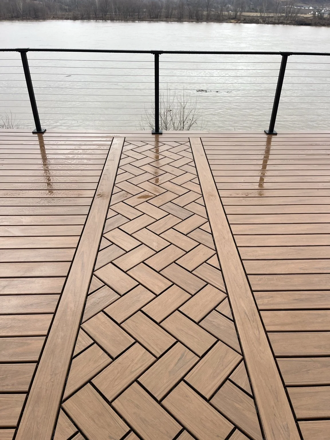 Herringbone-pattern decking detail overlooking the Ohio River at the Pallottine Sisters project in Huntington, West Virginia.