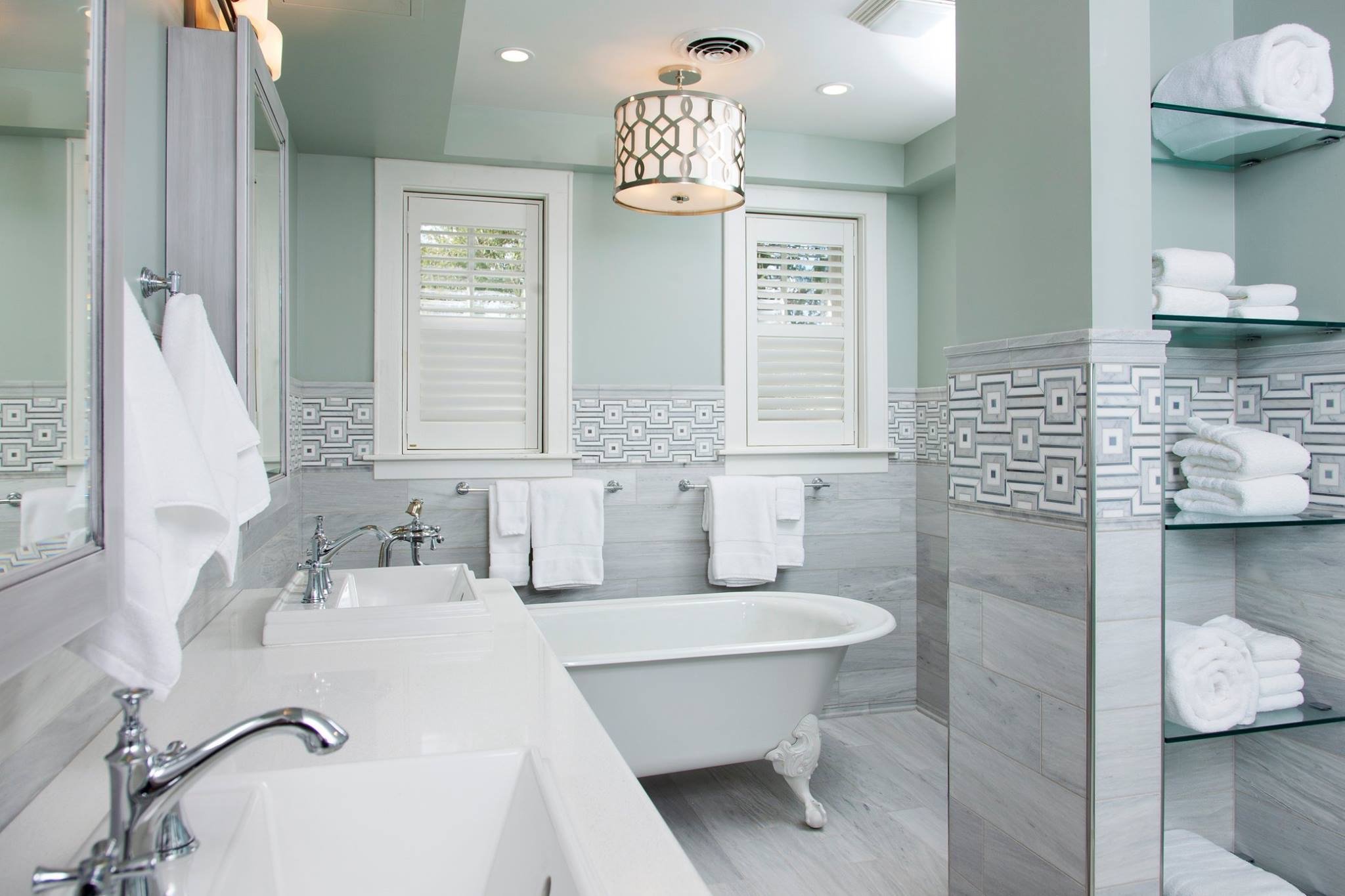 Renovated bathroom inside the Marshall University President’s House with custom finishes and freestanding tub.