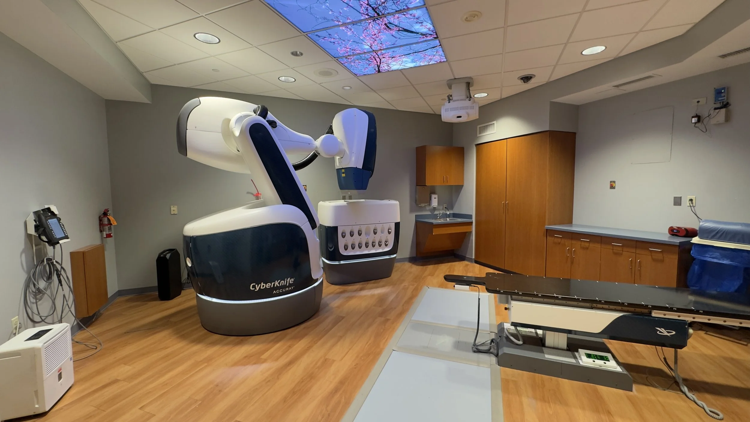 Completed CyberKnife treatment room with coordinated medical equipment, interior finishes and building systems.
