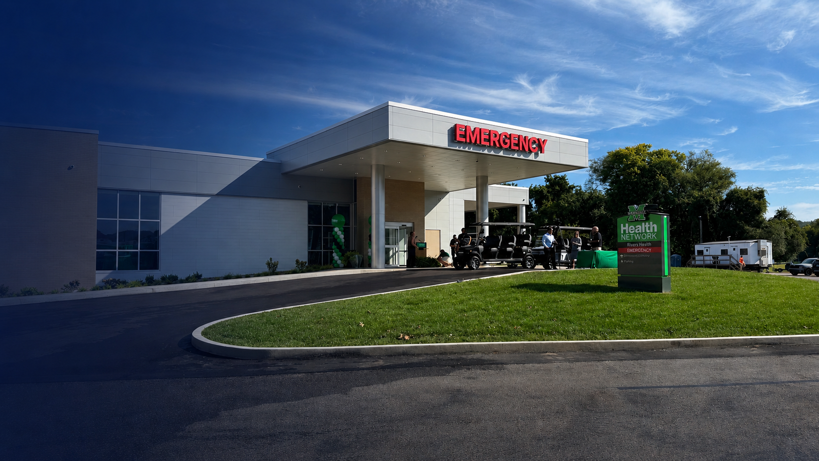 Outside view of a modern hospital emergency entrance, with a red 'EMERGENCY' sign, a parked golf cart, and a health network sign on the lawn.