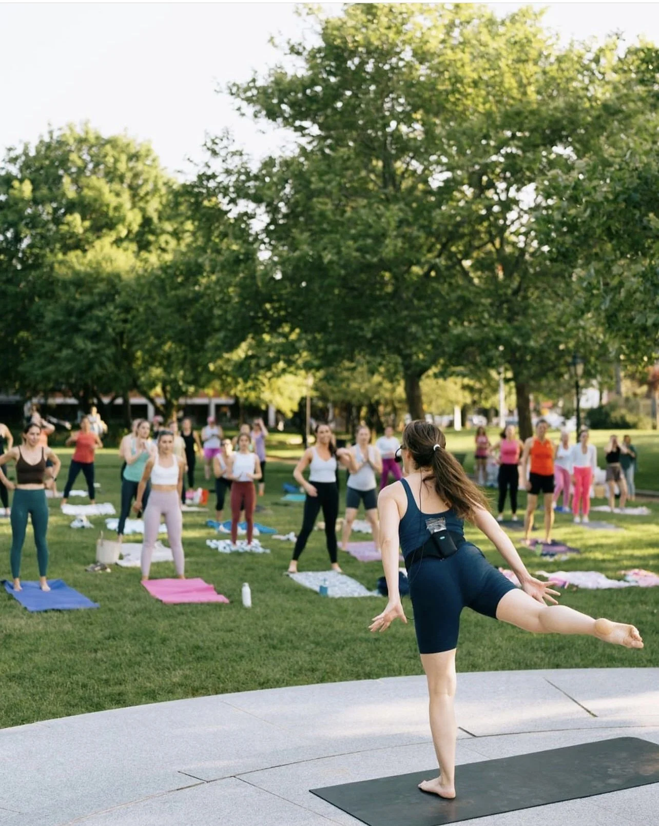 Meagan Fitzgerald teaching an empowering outdoor Pilates session in Newburyport, Massachusetts. She brings strength and mindset to each session. Join her for workouts and mindset coaching.