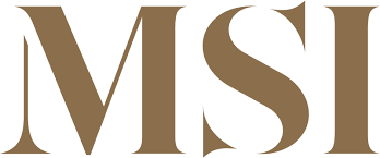 Close-up of the MSI logo on a product or sign in a golden-brown color.