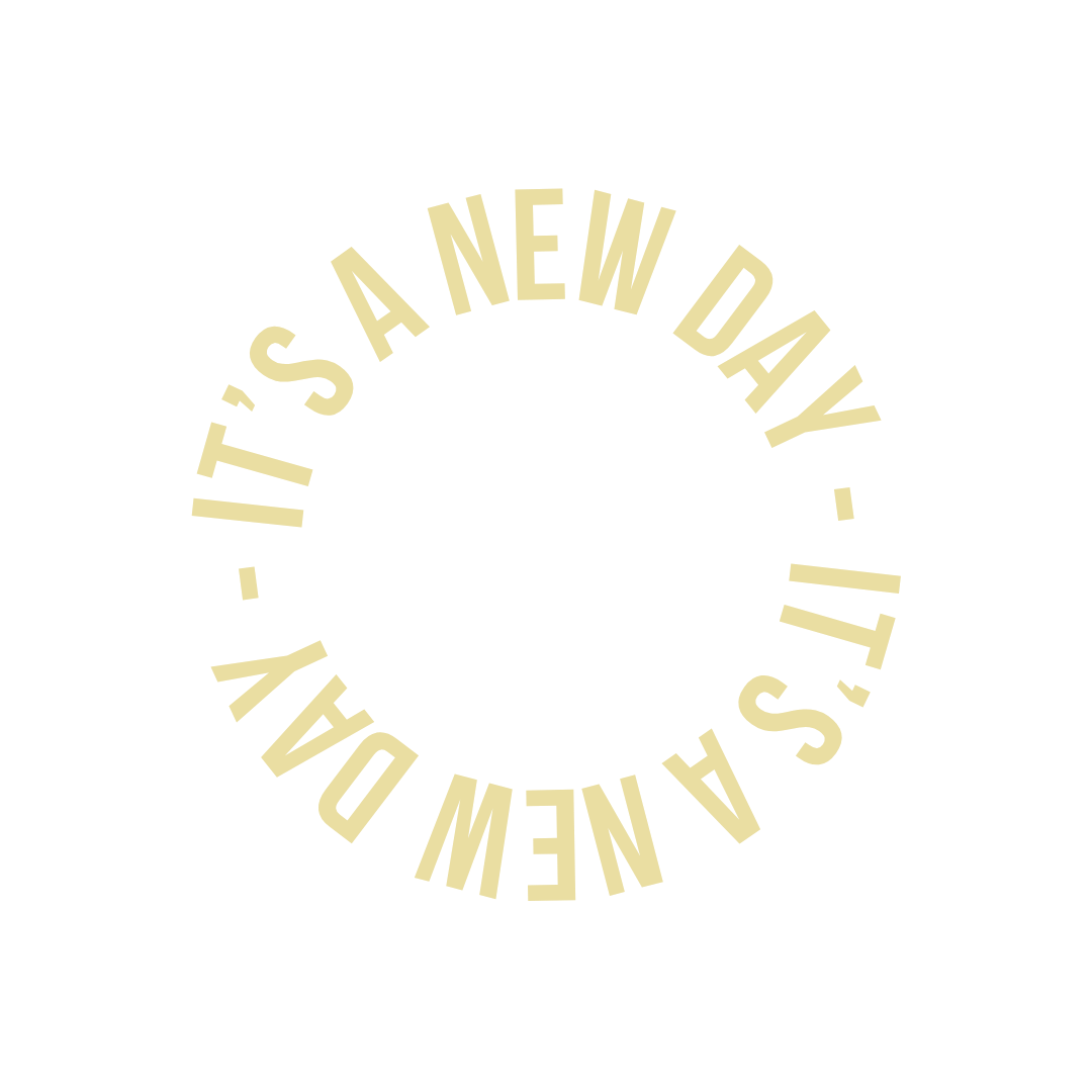 Circular text reading 'IT'S A NEW DAY. IT'S A NEW DAY.' in beige on a black background.