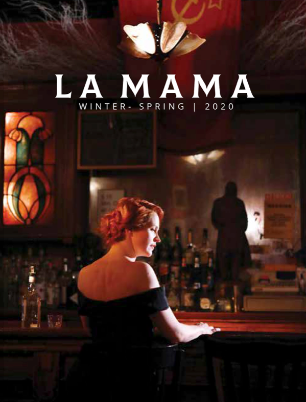 Cover of La Mamas magazine for Winter-Spring 2020, featuring a woman with red hair sitting at a bar inside a dimly lit restaurant or tavern.