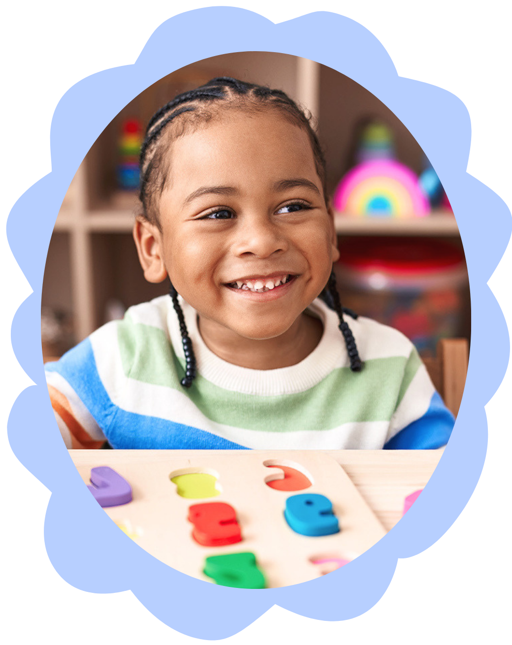 Young girl smiling while playing with colorful wooden learning toys, working on early language skills and speech sounds during in-home speech therapy for children in New York City.