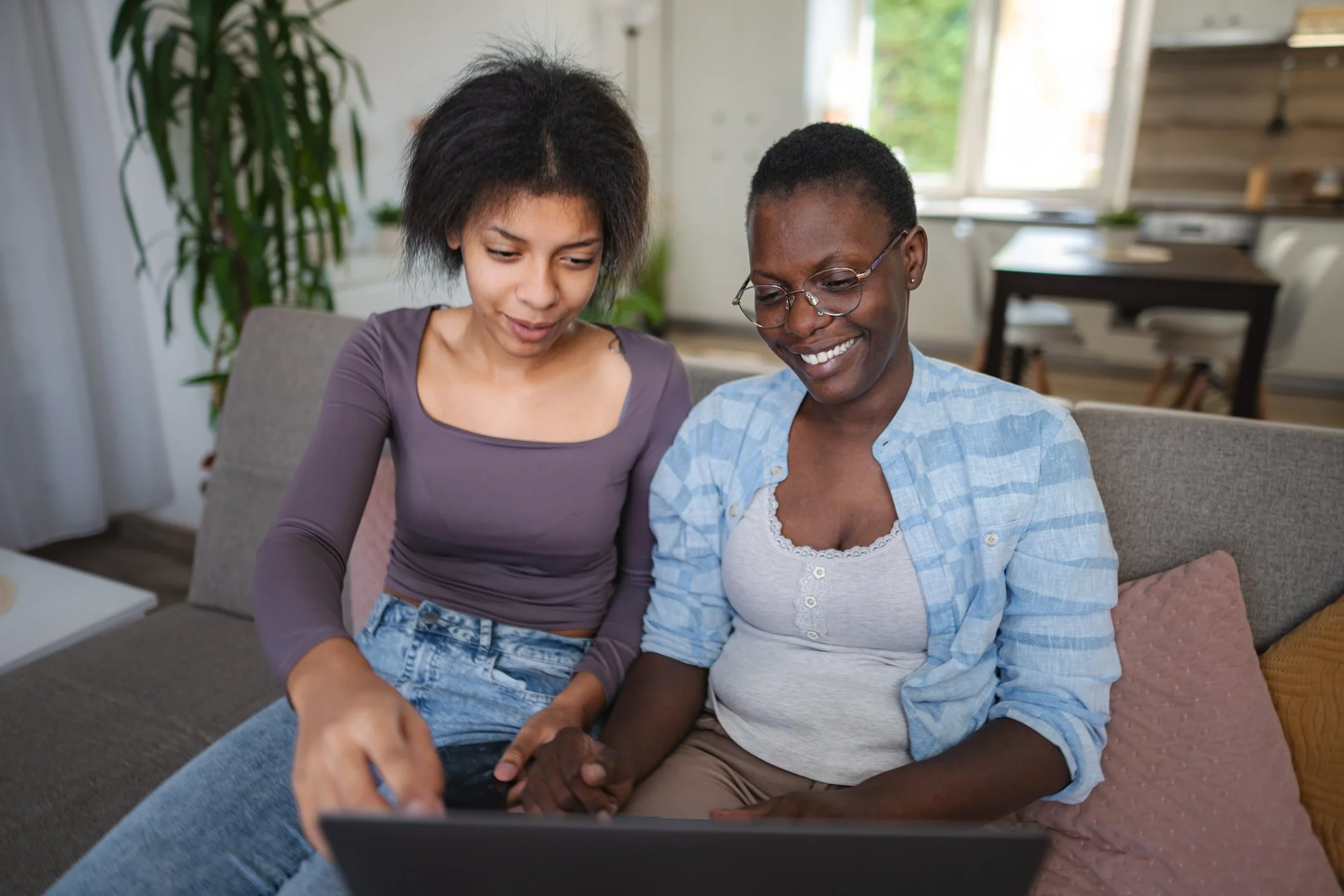 Helping with Technology 2 women on the couch