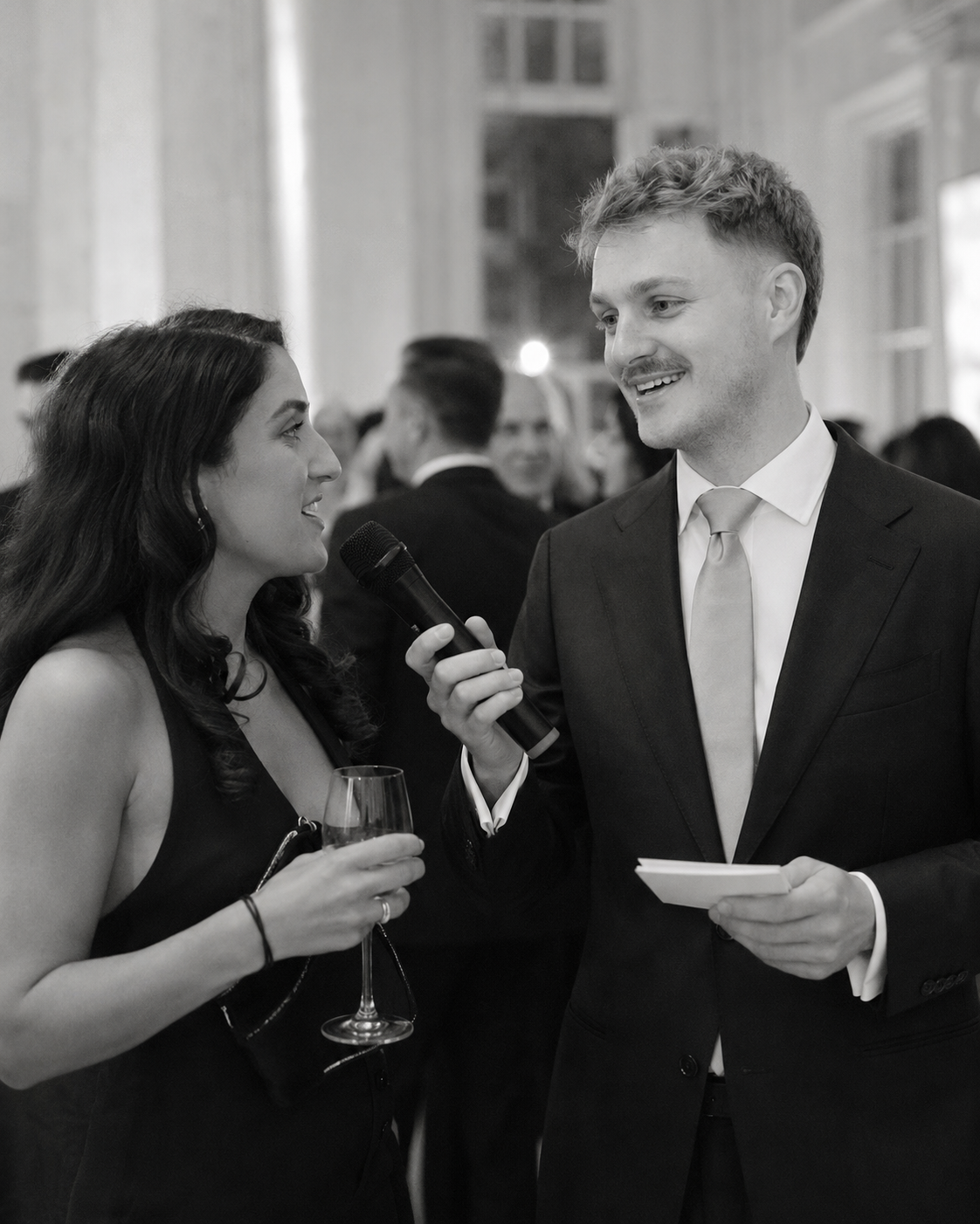 Hosted event guest interview with microphone at a private party or brand event