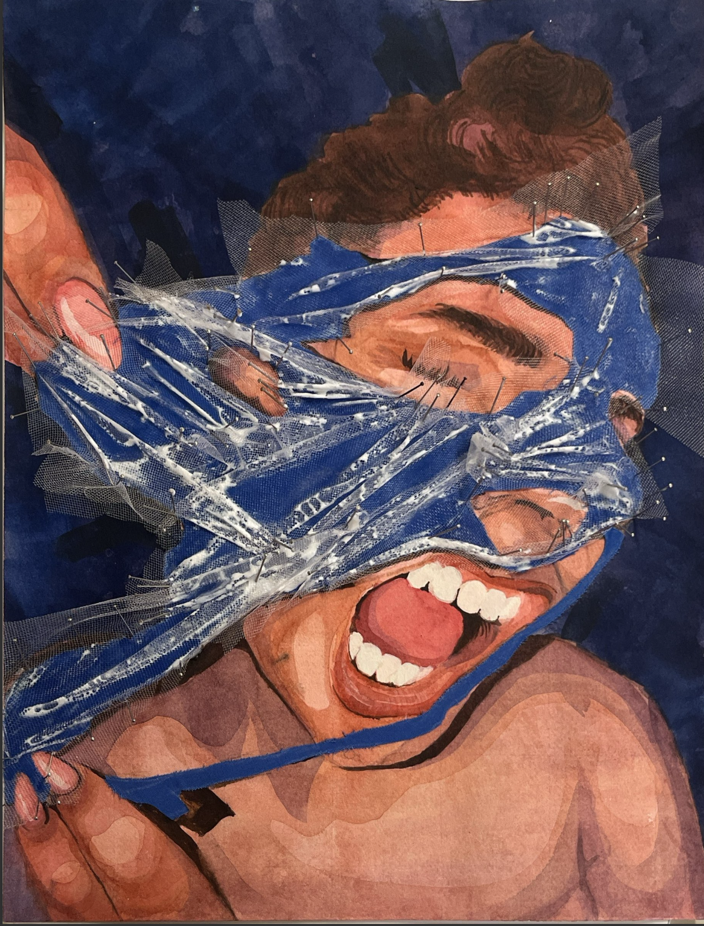 A woman with short brown hair is laughing and appears joyful. She is wearing a blue headband and has a tattoo on her shoulder. Her hand is covering her left eye, and she is showing her teeth in a broad smile. The background is dark, and her skin tone