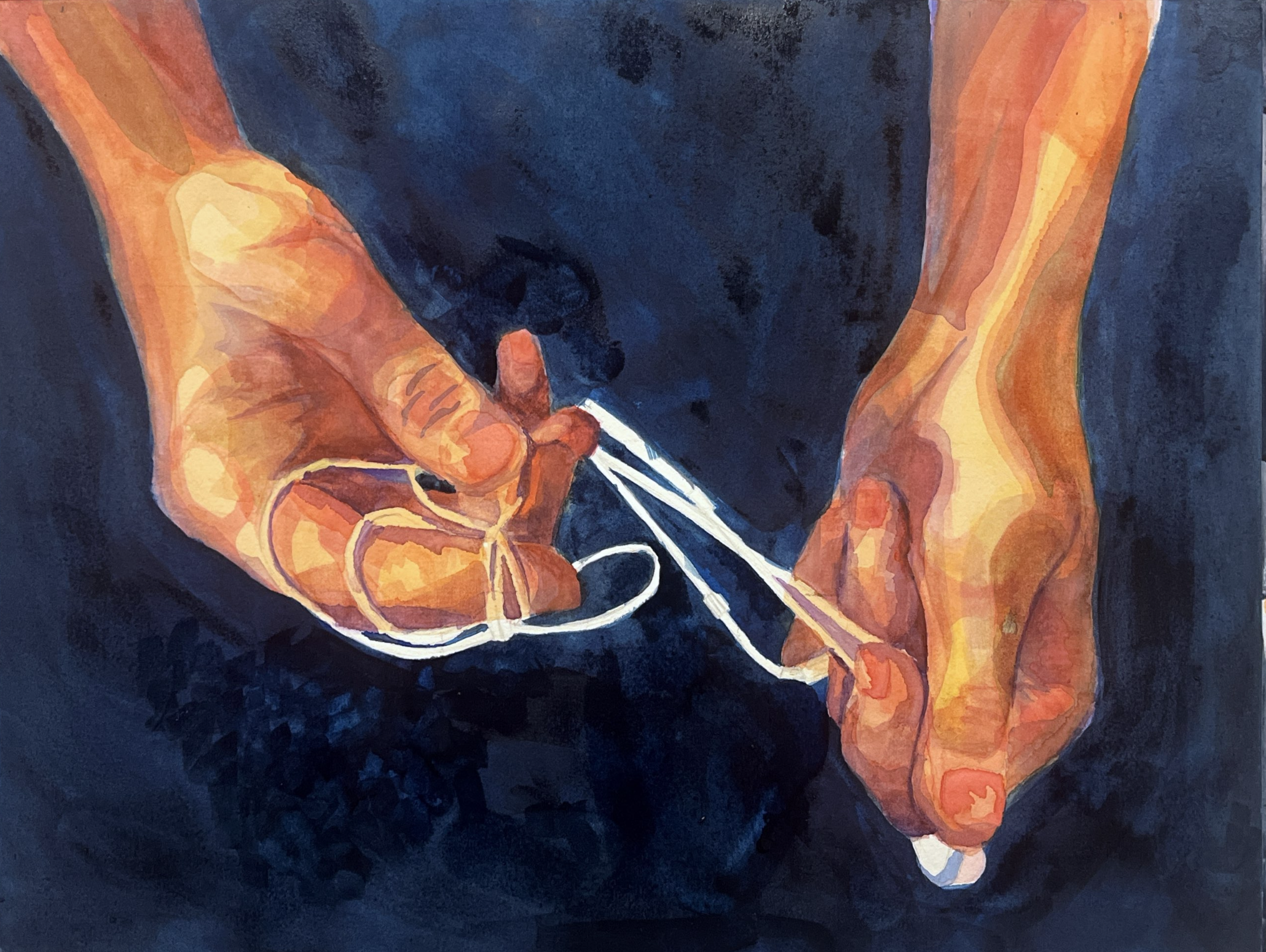 A person with dark hair and skin tone, wearing an orange shirt, is holding a white cable or cord in their hand. The background is dark, and the person’s face is partially visible, slightly blurred.