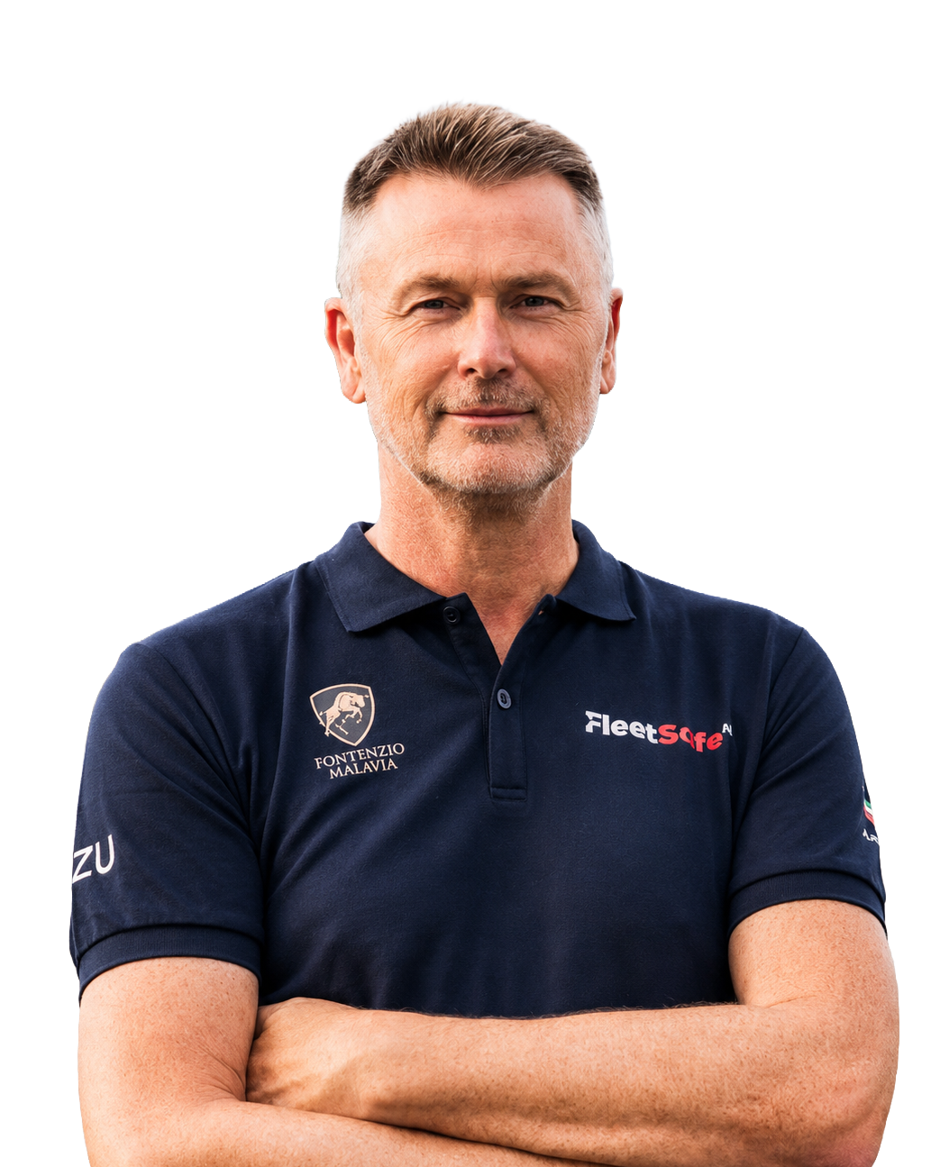 A middle-aged man with short light brown hair and a light beard, wearing a navy blue polo shirt with logos, standing with arms crossed against a neutral background.