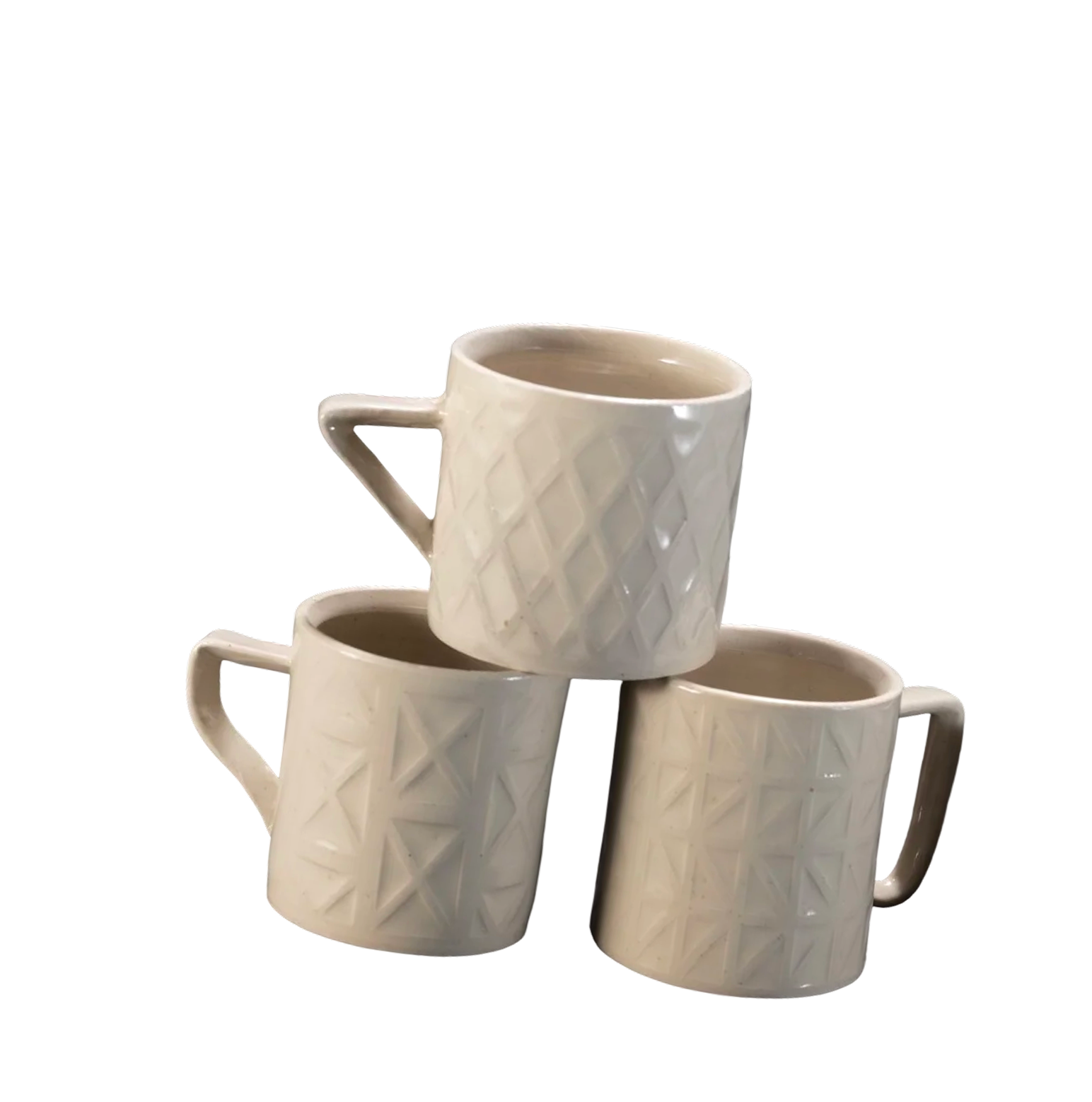 Stacked white ceramic coffee mugs with a diamond pattern on their surface, against a black background.
