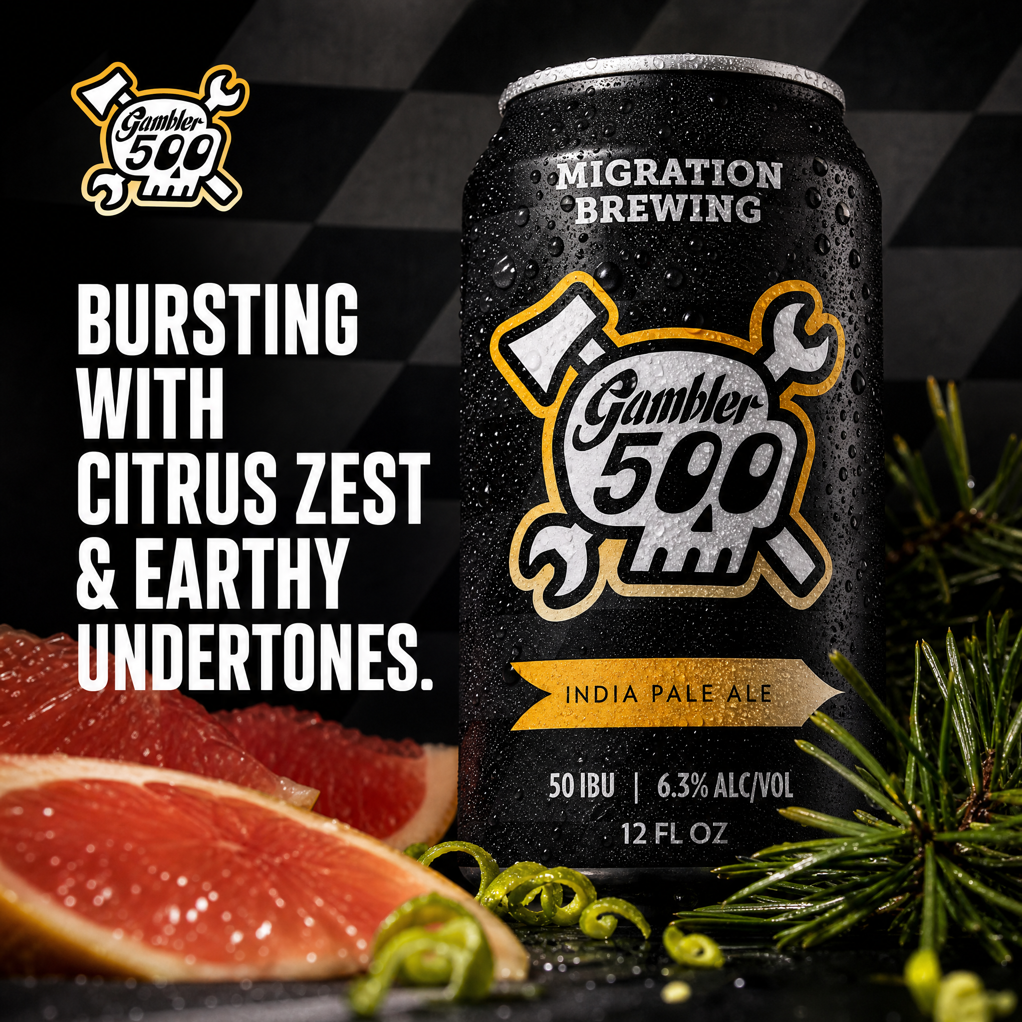 A black can of Gambler 500 India Pale Ale with water droplets on it, placed on a surface with sliced red grapefruit, green herbs, and sprigs of rosemary around it. The can's label indicates it contains 6.3% alcohol, 50 IBU, and is 12 ounces.