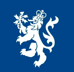 A white lion holding a branch with leaves on a blue background, with a crown on its head, representing a heraldic symbol or emblem.
