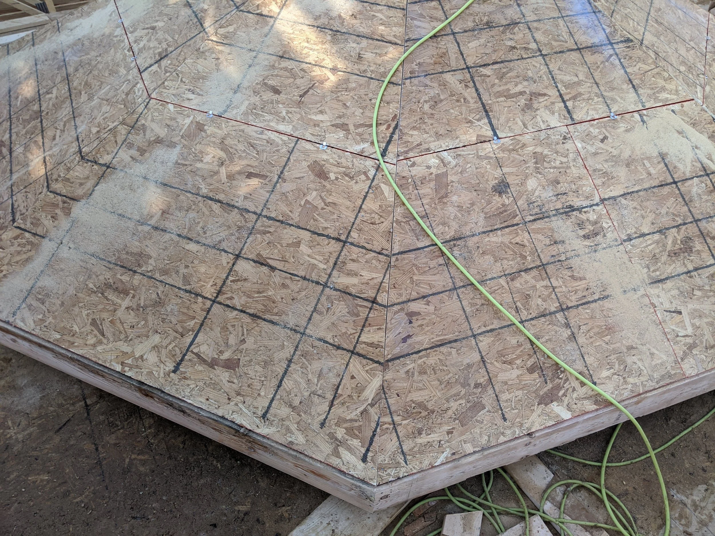Octagonal tower roof sheathed on the ground