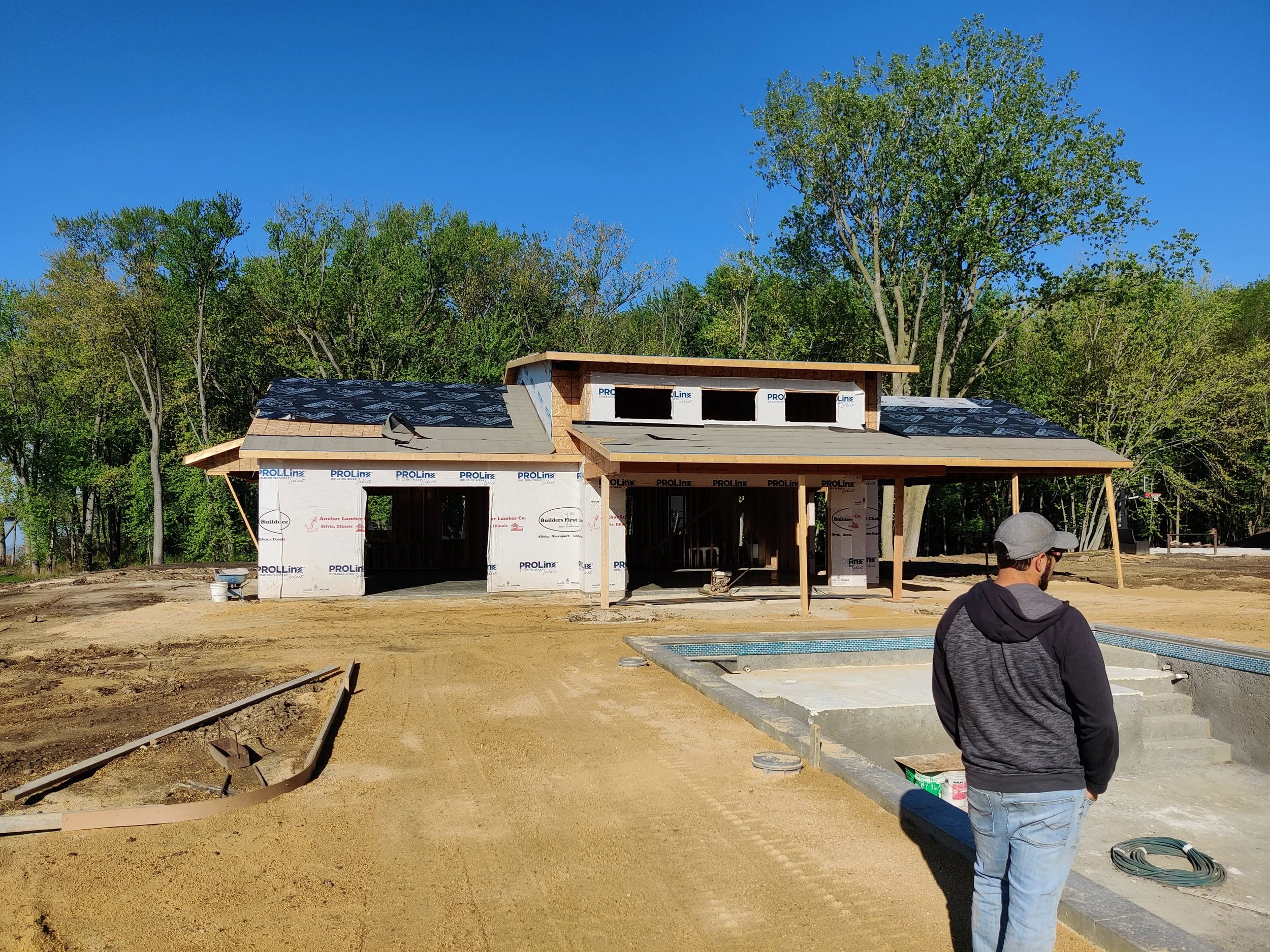 Pool house exterior beside the pool on a Mississippi River property