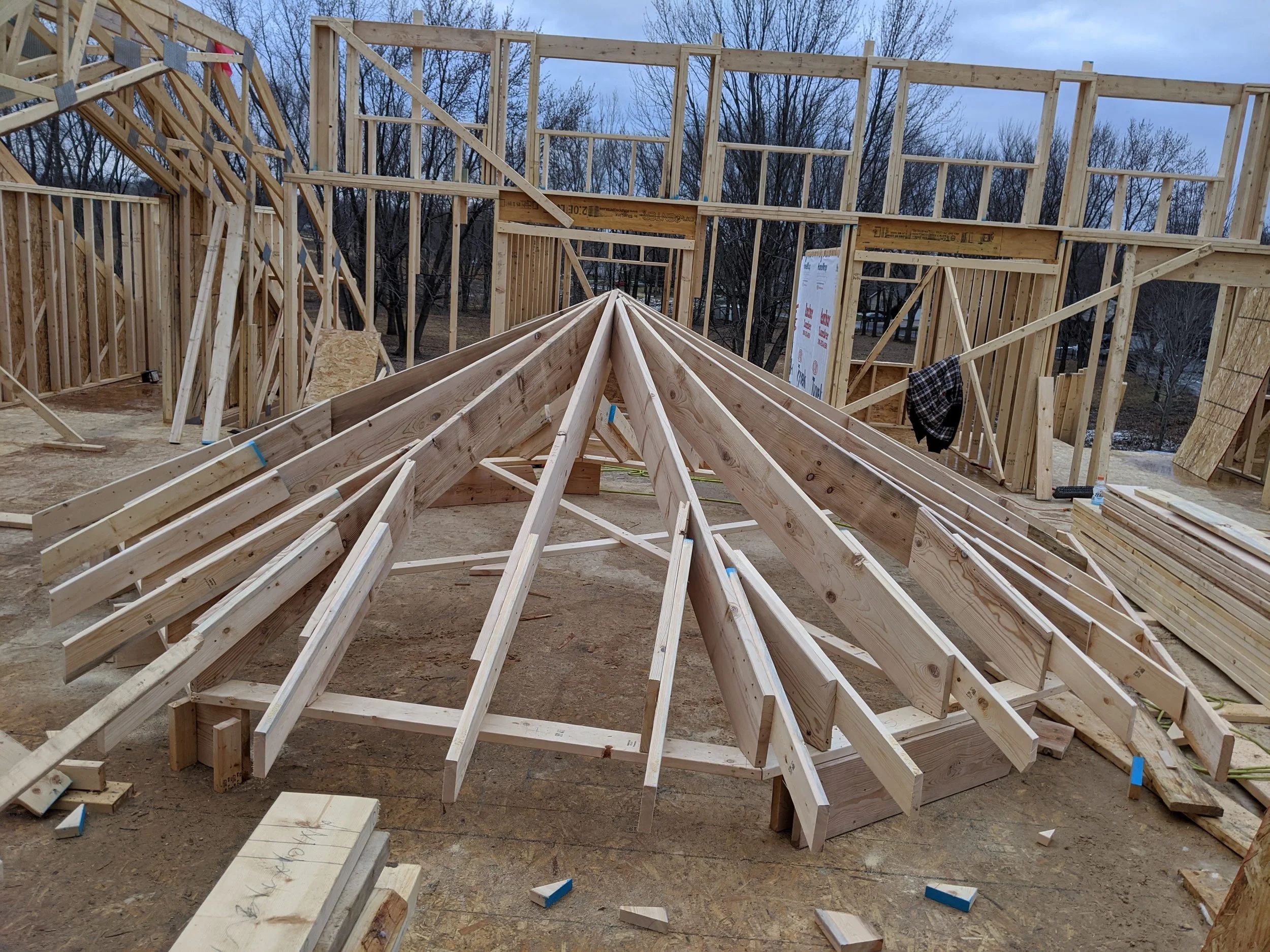 Octagonal hip roof framed on the subfloor before crane lift