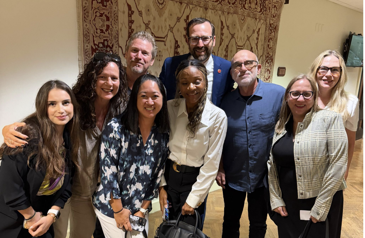 Eaton and Palisades fire survivors and allies with Senator Ben Allen after winning passage of SB 1301 at the Assembly Insurance Committee