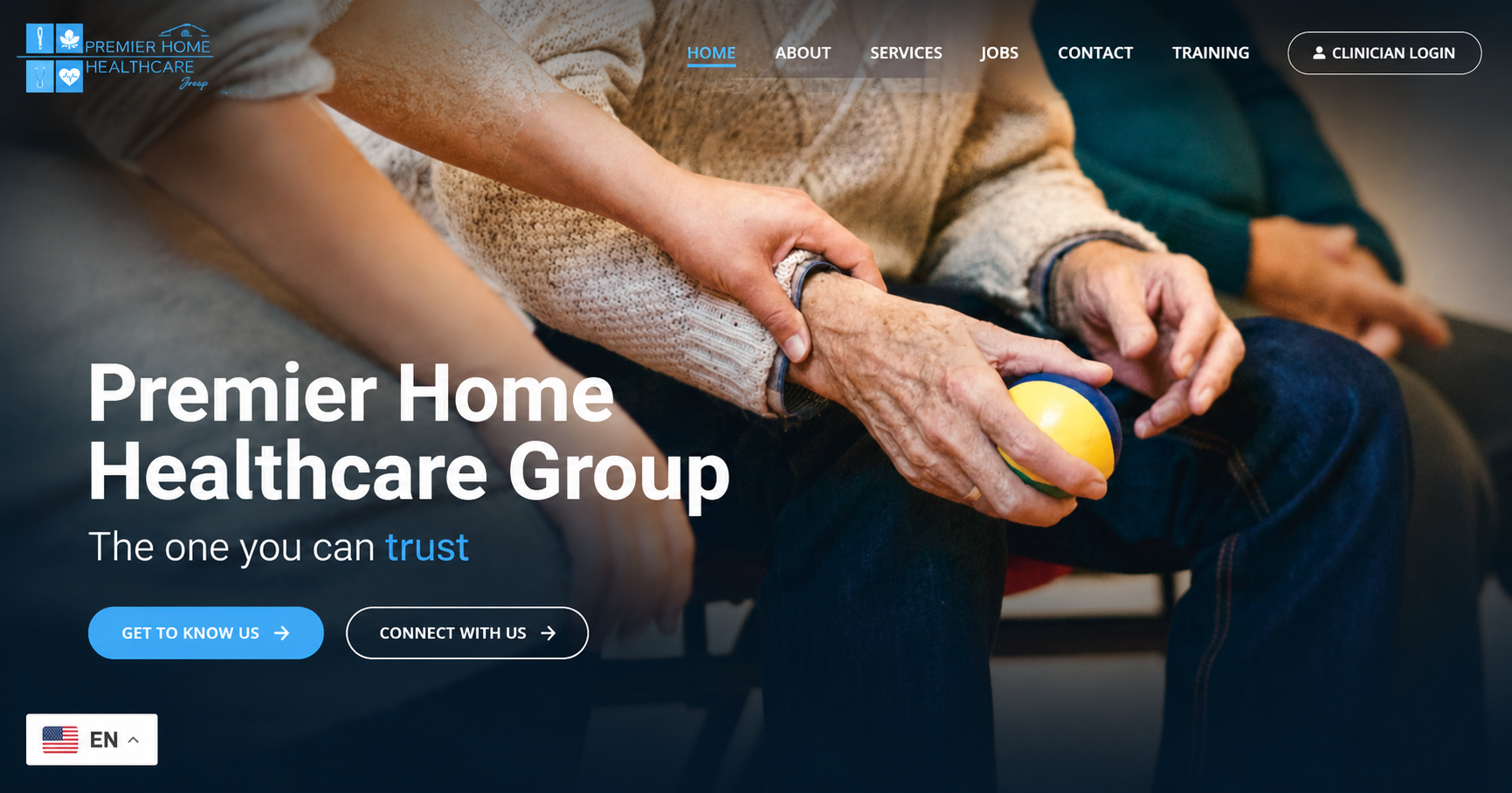 A caregiver assisting an elderly person holding a yellow and blue ball, in a healthcare setting with a website overlay showing navigation options.