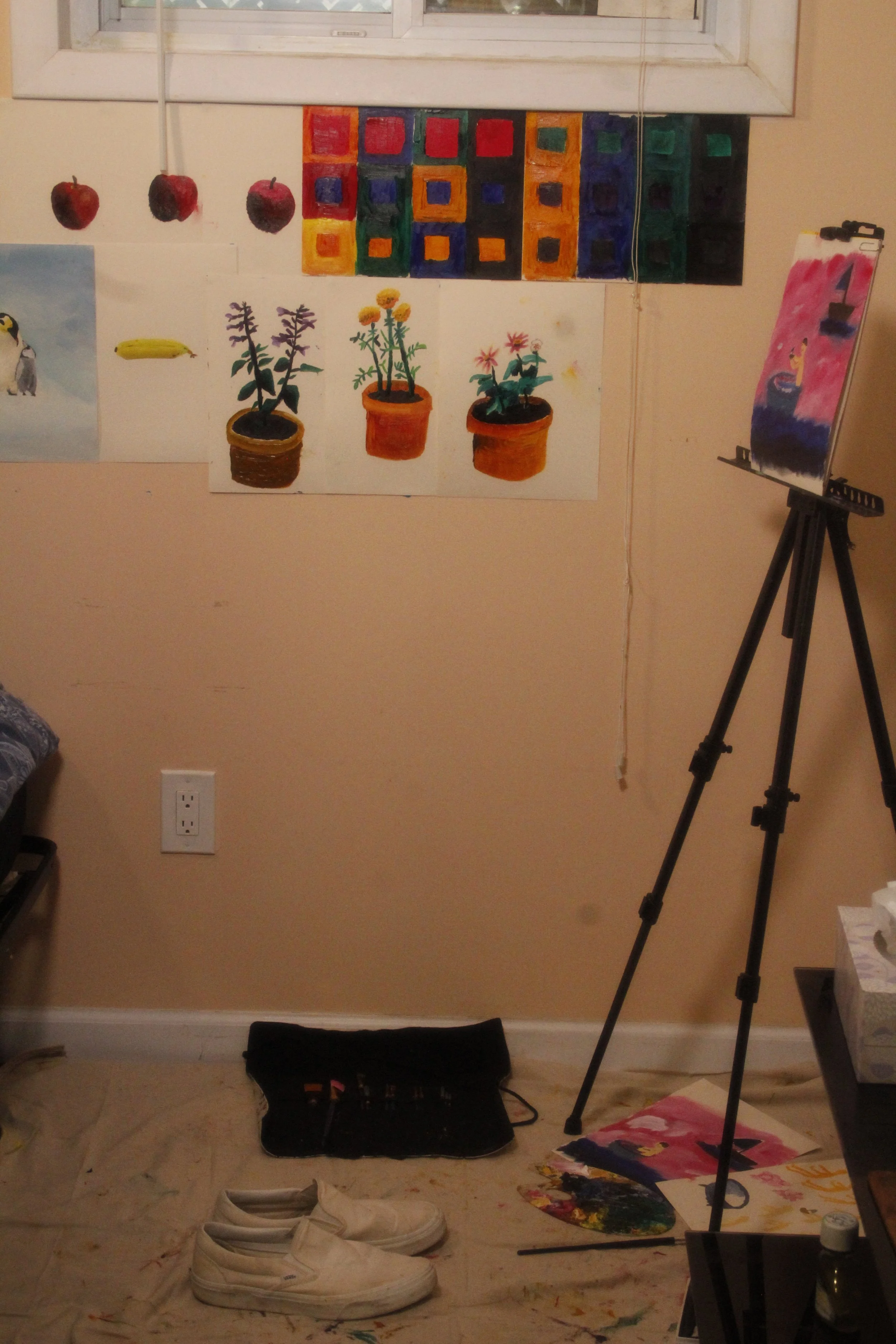 Behind-the-scenes view of the studio where advertising concepts were photographed and illustrated, showing paintings, an easel, and creative workspace.