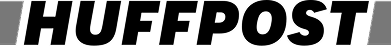 A gray and black object with a small red circle on top, partially visible in the image.
