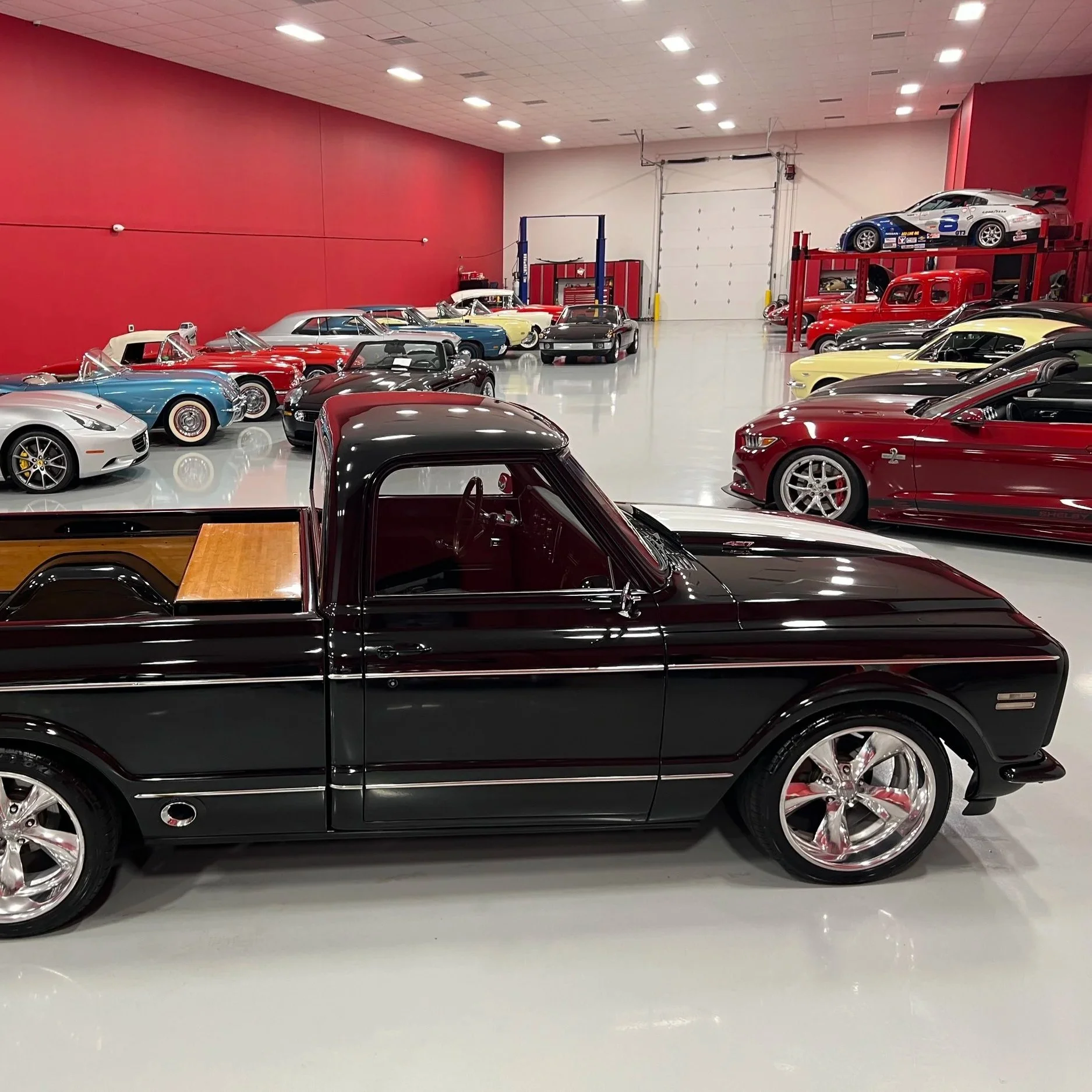 Indoor drone footage of a classic car showroom, captured as brand and marketing content for a local business