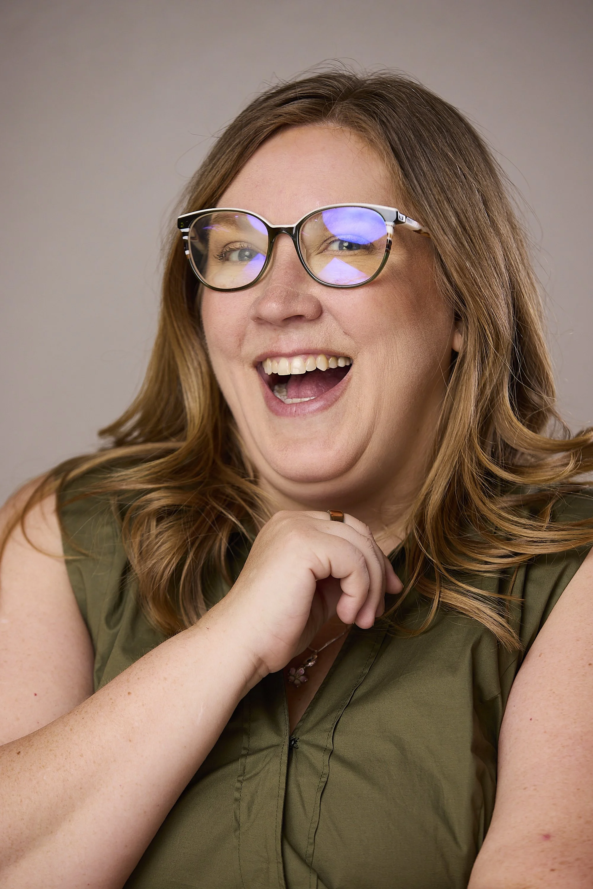 Amanda, co-founder of DripFeed, laughing during her portrait session.