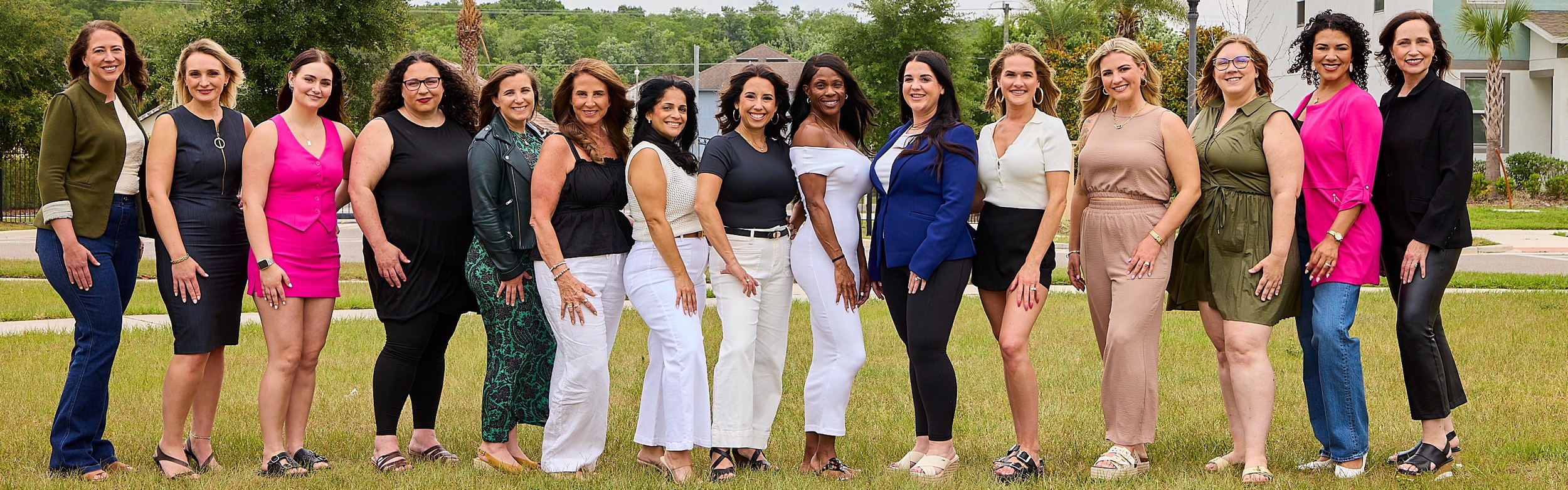 Women in the trades gathered outdoors for a group photograph.