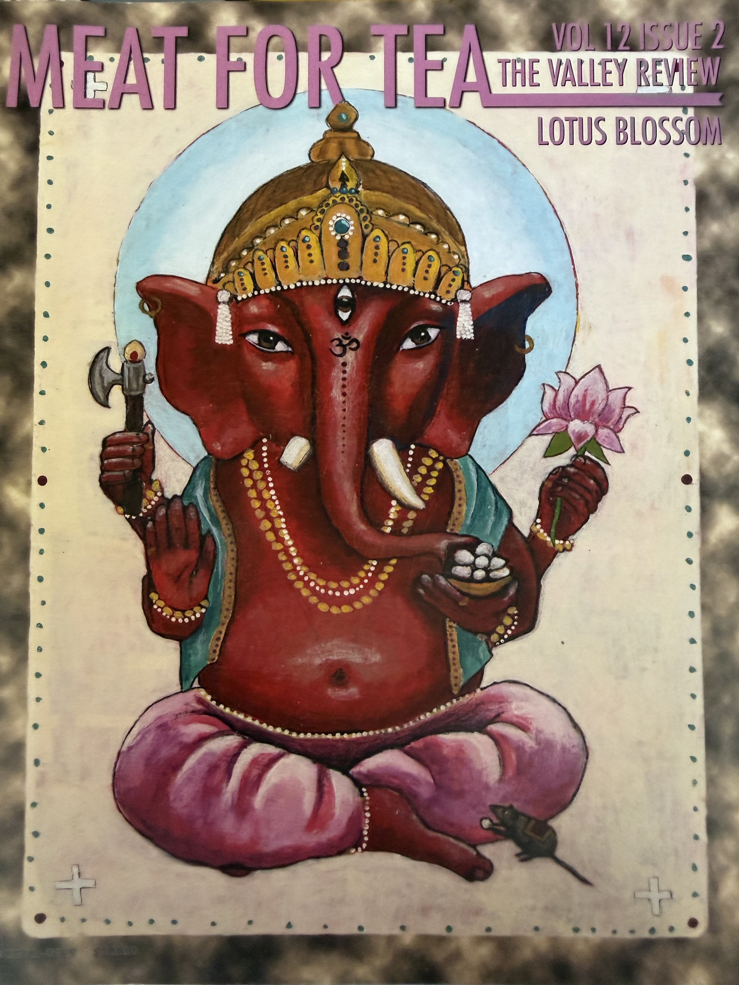 A colorful illustration of Ganesha, the Hindu elephant-headed god, depicted with a red body, adorned with jewelry and a crown, holding a lotus flower and an axe, sitting on a pink lotus flower.