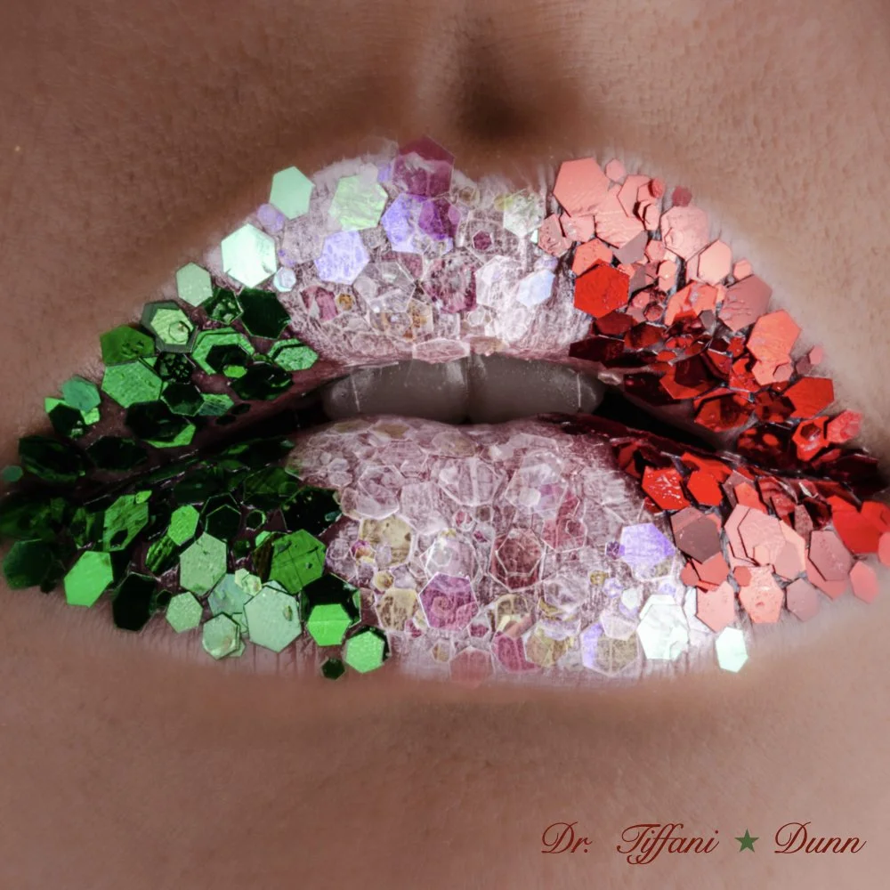 Close-up of lips with glitter makeup in red, green, silver, and purple colors, with the name 'Dr. Tiffani Dunn' written in red at the bottom right corner.