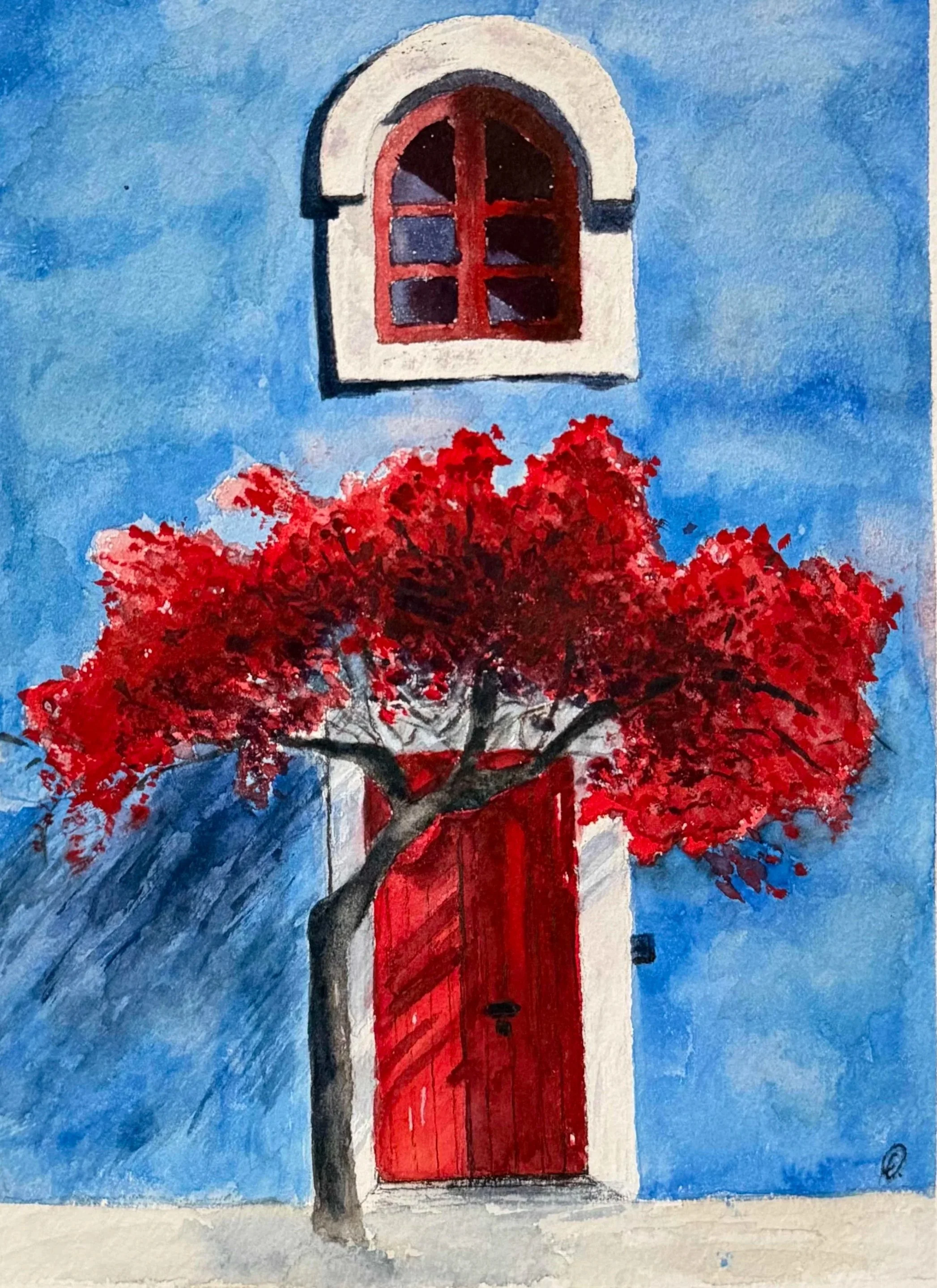 Blue house in Morocco with red door