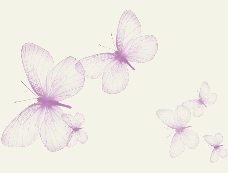Light purple butterflies with delicate wings flying against a pale background.